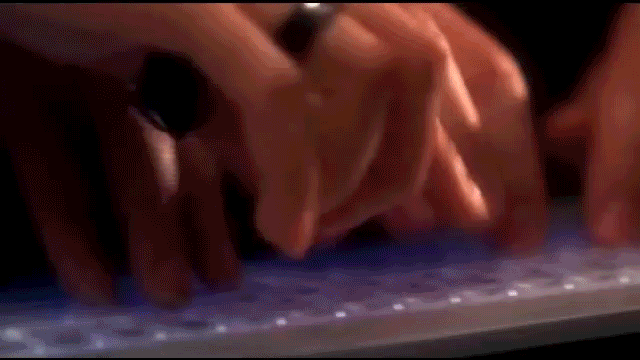 Clip from NCIS showing two people typing manically on one keyboard
